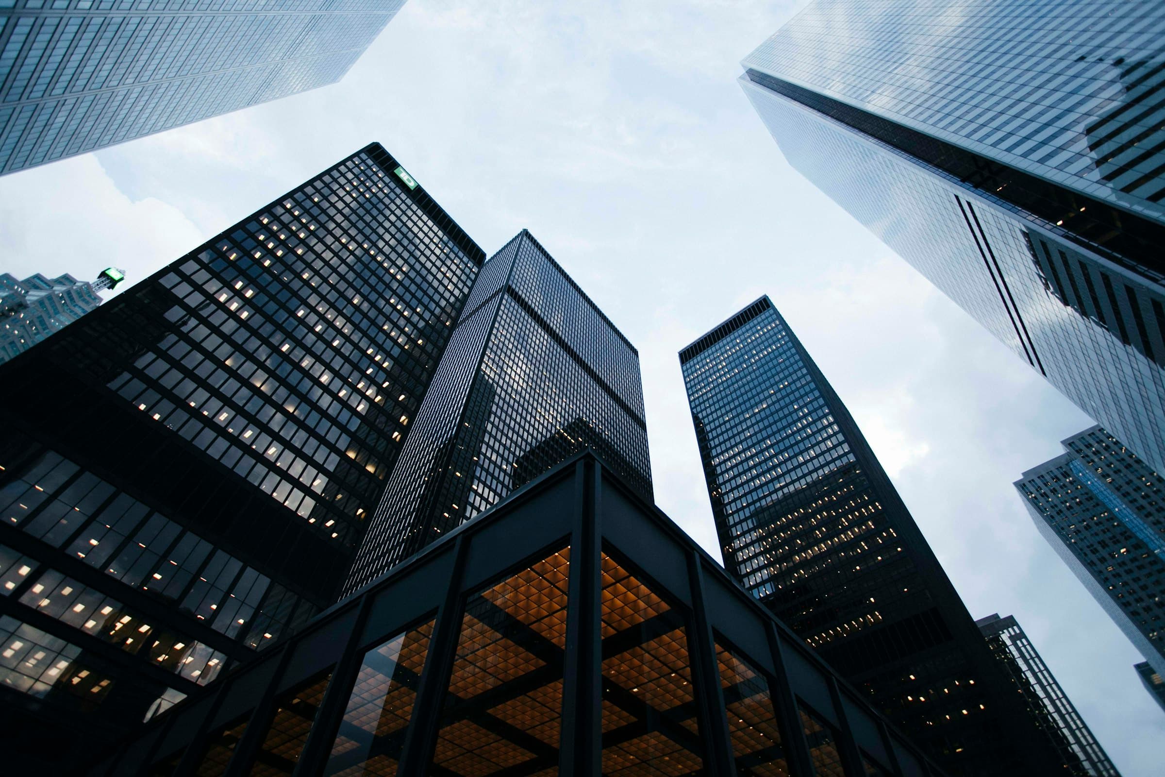 Modern glass commercial architecture at dusk